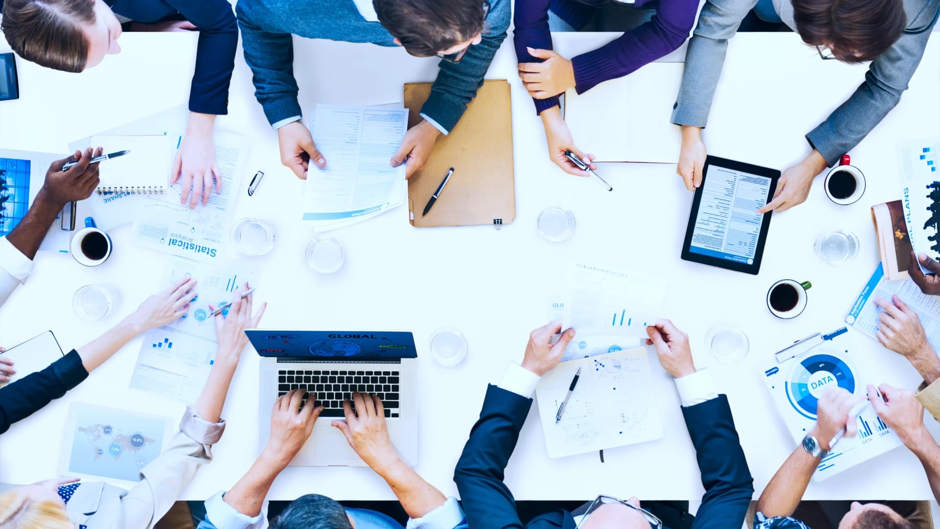 A group of coworkers collaborating around a table.